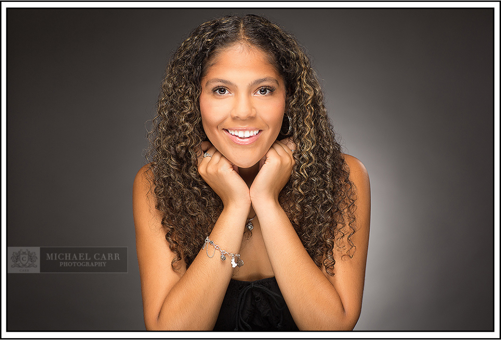 Professional Photographer Houston Houston senior portrait with timeless studio lighting and natural expression