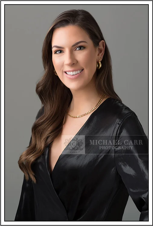 Professional Photographer Houston Modern casual headshot on a gray studio background at Michael Carr Photography