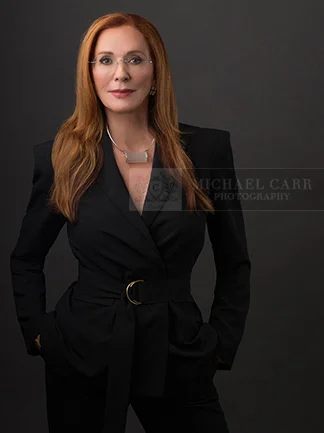 Professional Photographer Houston Executive portrait of a Houston business professional photographed on a classic studio background.