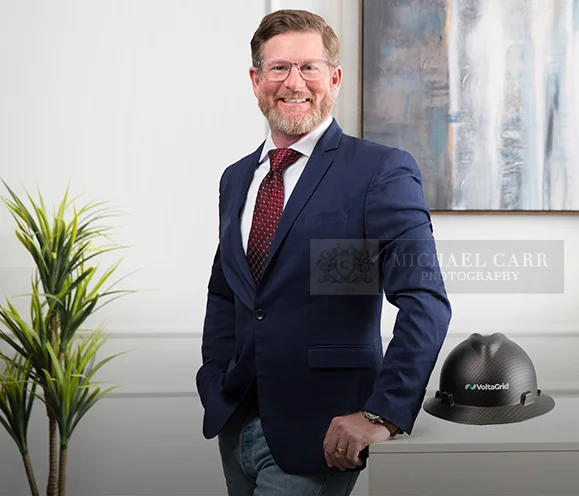 Professional Photographer Houston Personal branding portrait of a business owner photographed with company branding elements in the studio.