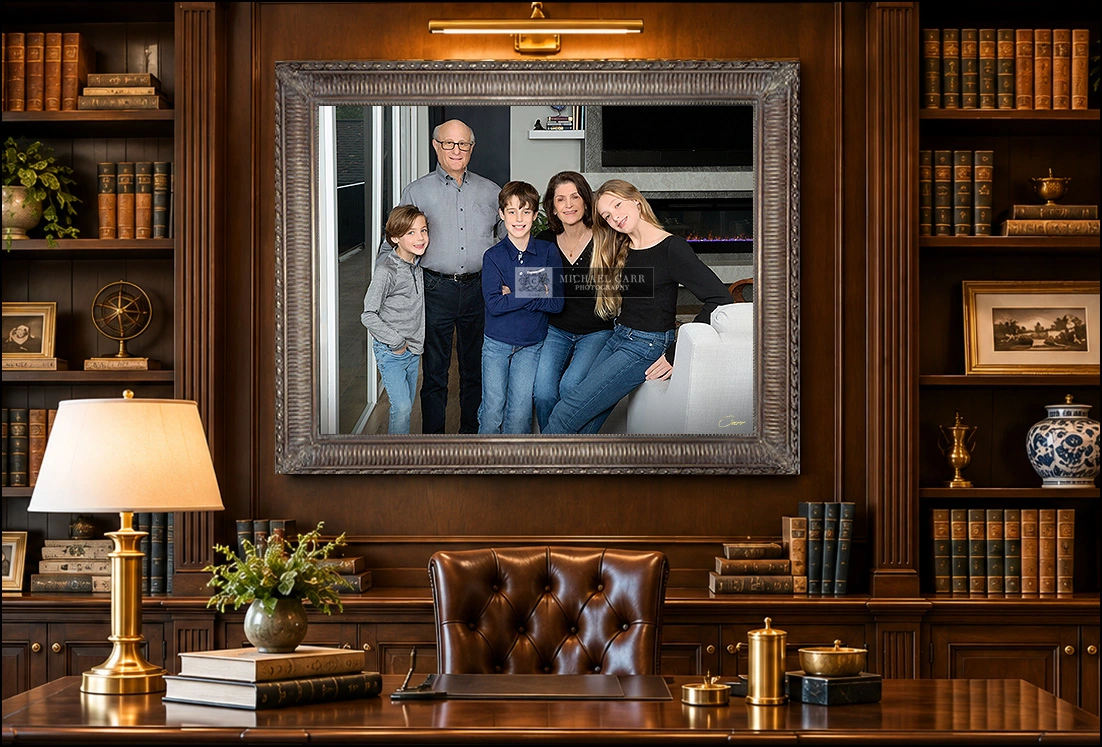 Framed portrait of grandparents and grandkids displayed on the wall of an elegant home office.