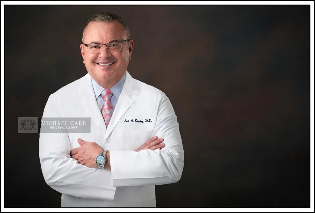 Physician wearing a white coat in a professional studio portrait